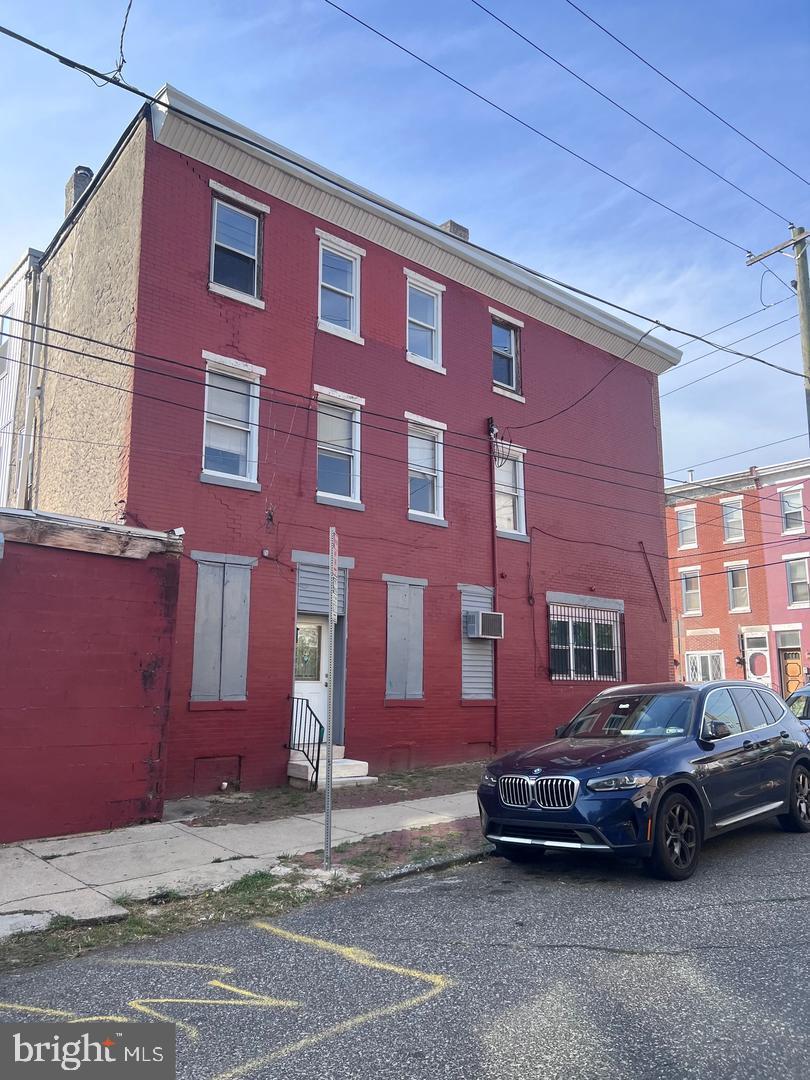 861 Perkiomen Street Philadelphia, PA 19130 - Photo 4 of 35 a car parked in front of a brick building