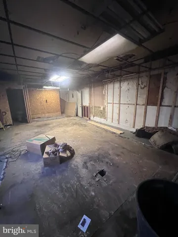 a view of a livingroom with a kitchen