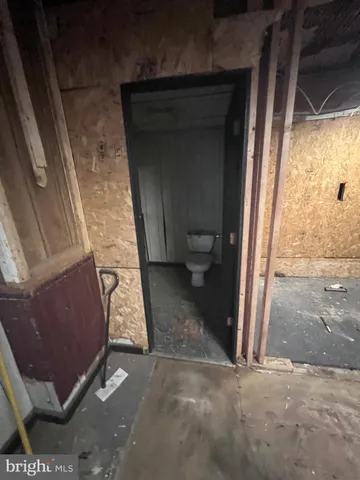 a view of a door and chair in an empty room
