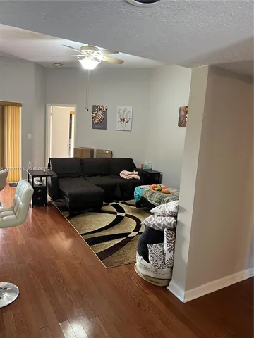 a bedroom with two beds and a flat screen tv