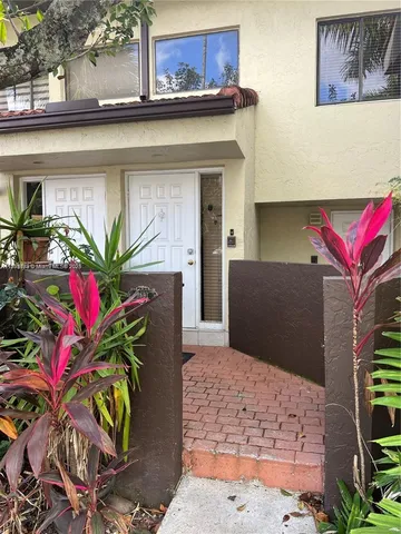 a potted plant sitting on a wooden floor