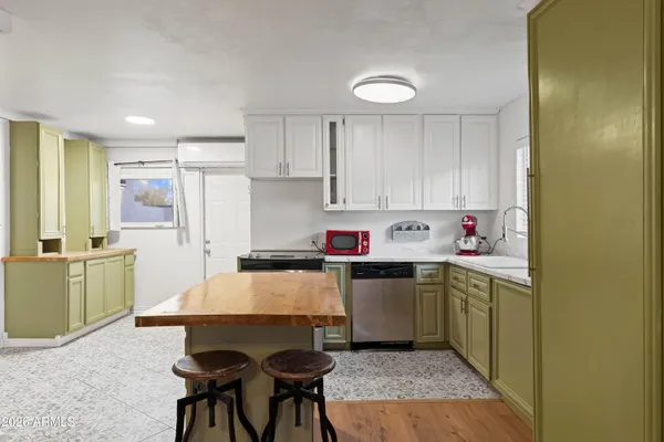 a kitchen that has a sink and chair