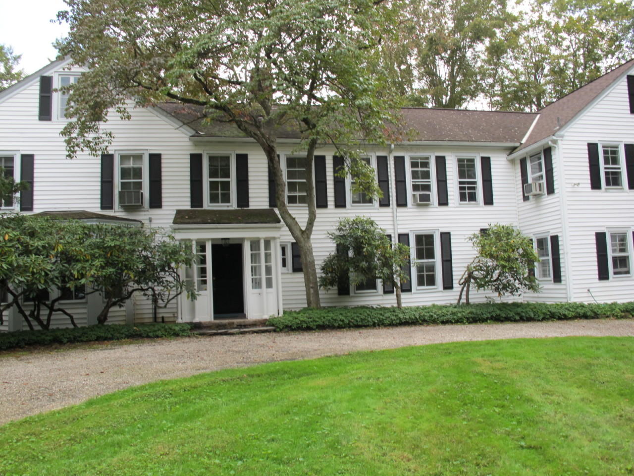 280 Rosebrook Road New Canaan, CT 06840 - Photo 3 of 12 front view of a house with a yard