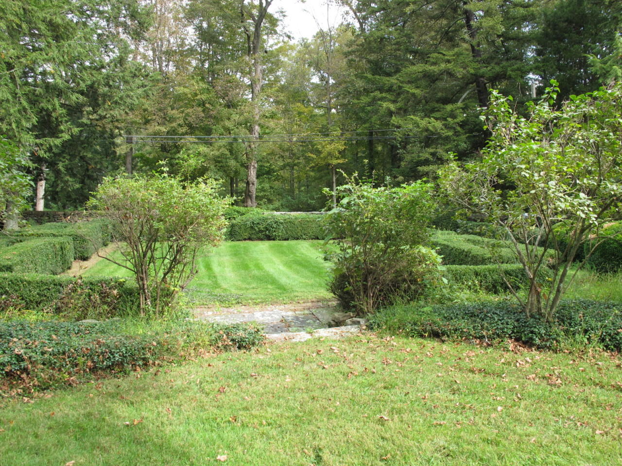 280 Rosebrook Road New Canaan, CT 06840 - Photo 6 of 12 a view of a garden with a lake