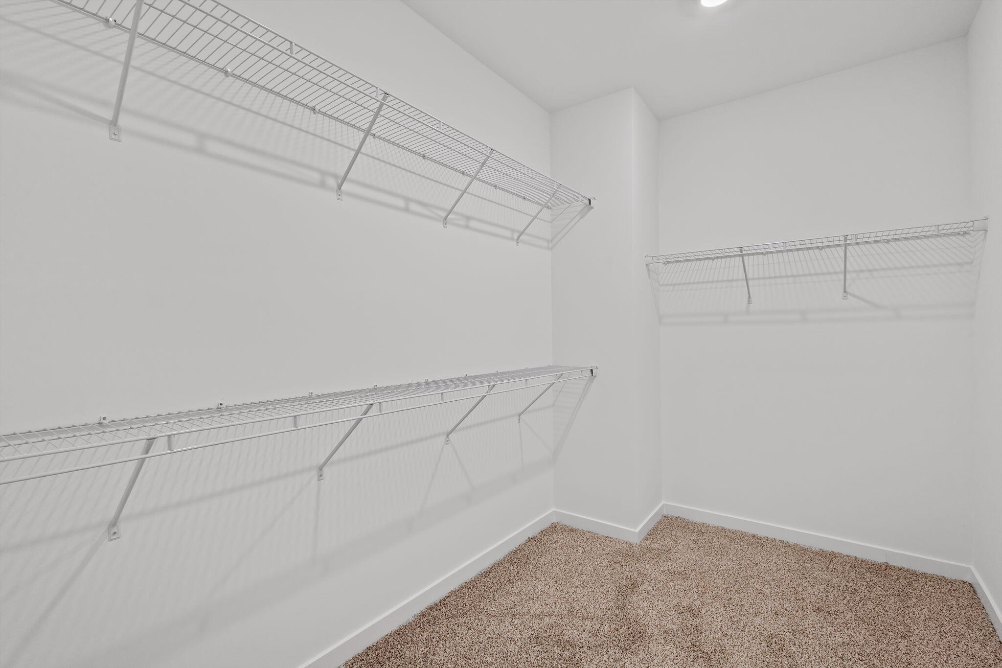 7293 West 107th Place Crown Point, IN 46307 - Photo 15 of 24 a view of a room with racks on the wall