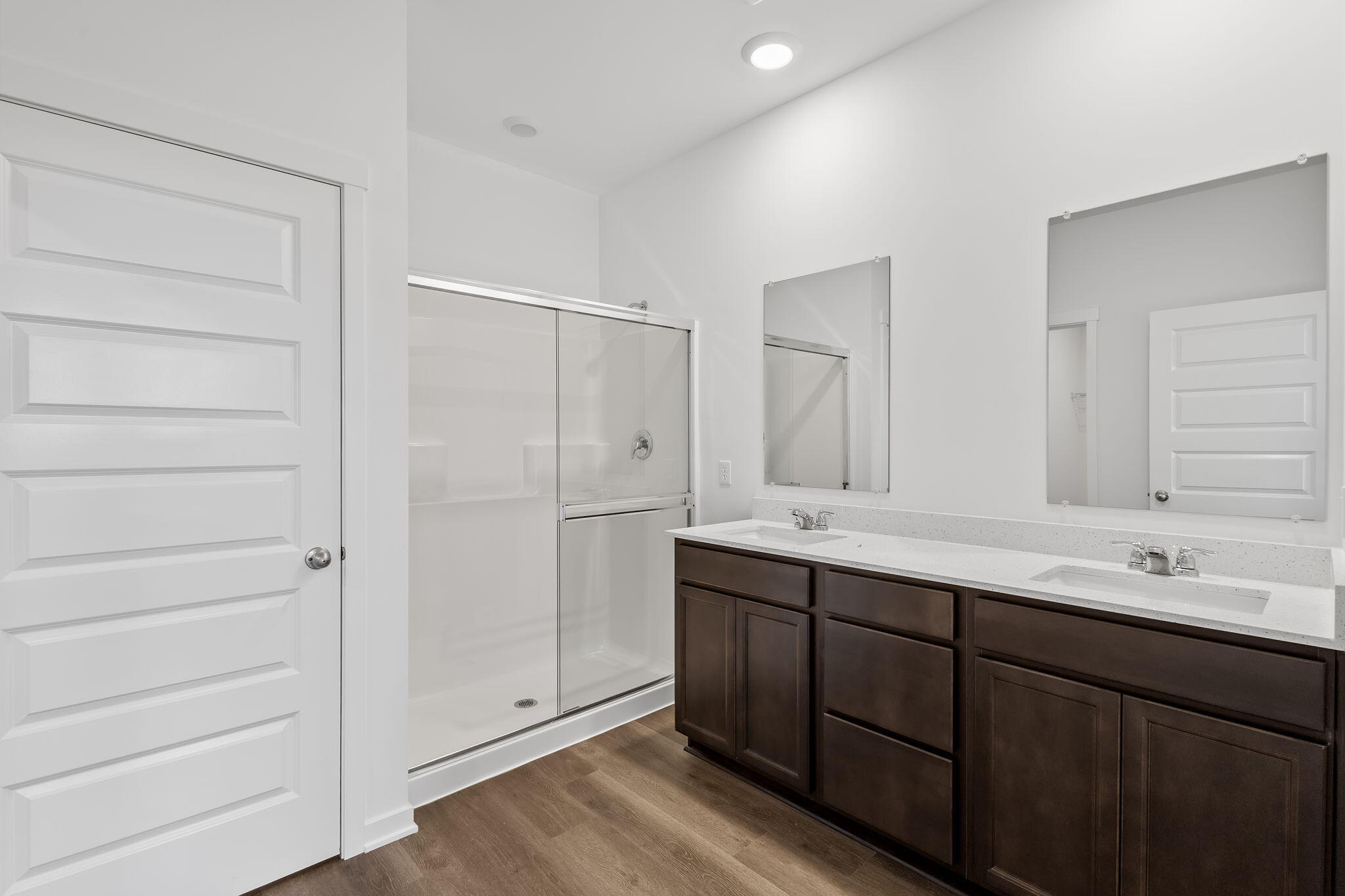 7293 West 107th Place Crown Point, IN 46307 - Photo 16 of 24 a bathroom with a double vanity sink and mirror
