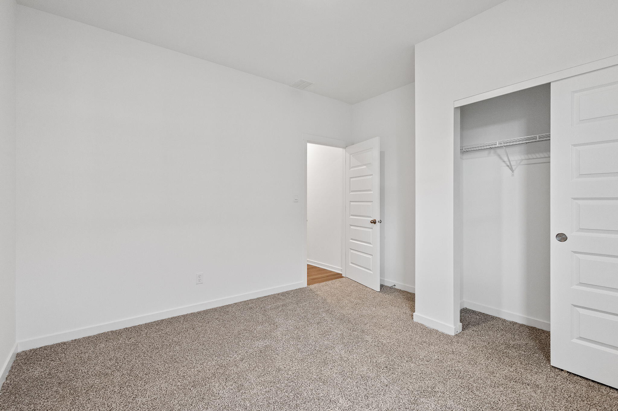 7293 West 107th Place Crown Point, IN 46307 - Photo 17 of 24 an empty room with an entryway