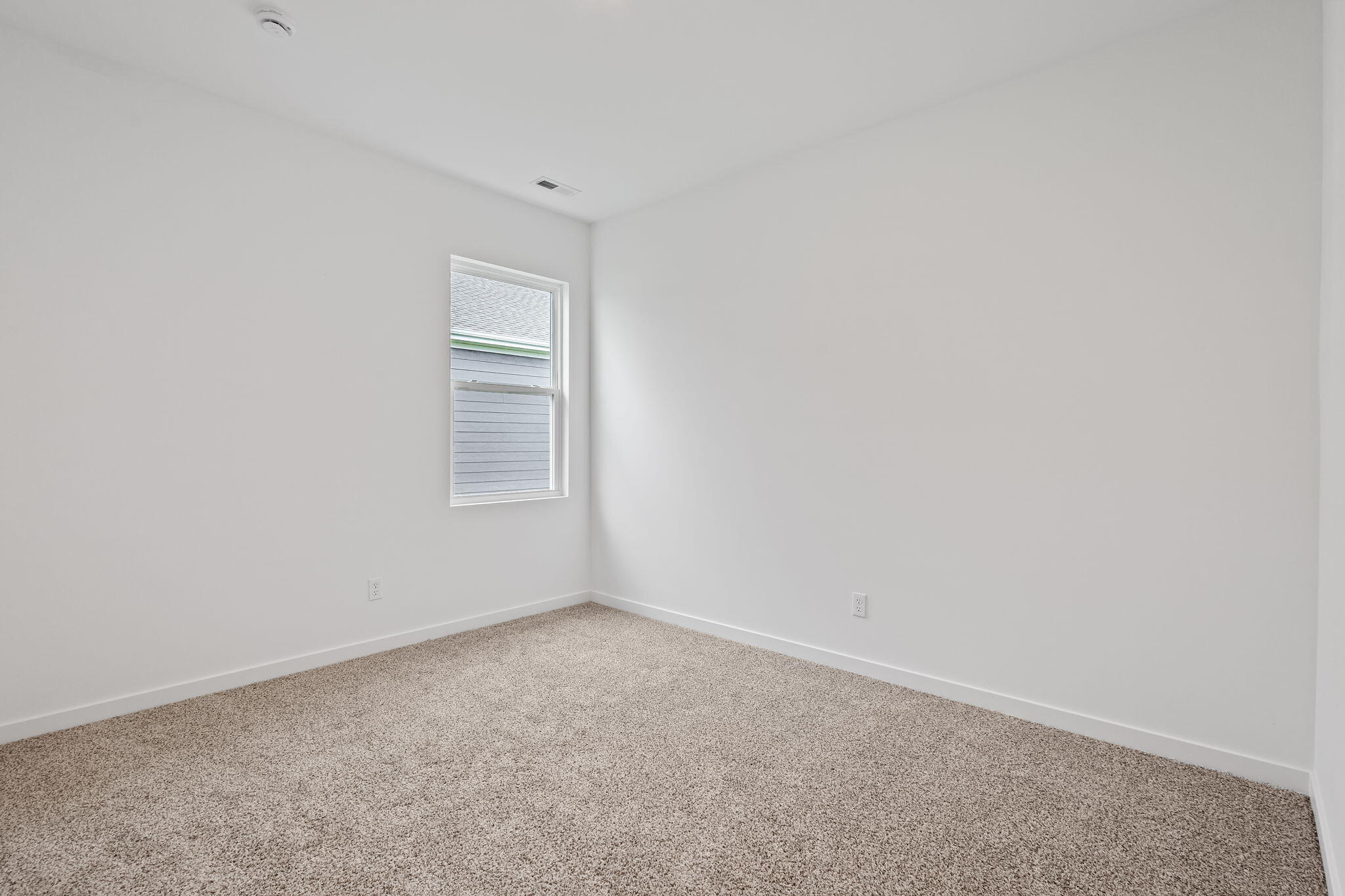 7293 West 107th Place Crown Point, IN 46307 - Photo 18 of 24 a view of an empty room with a window