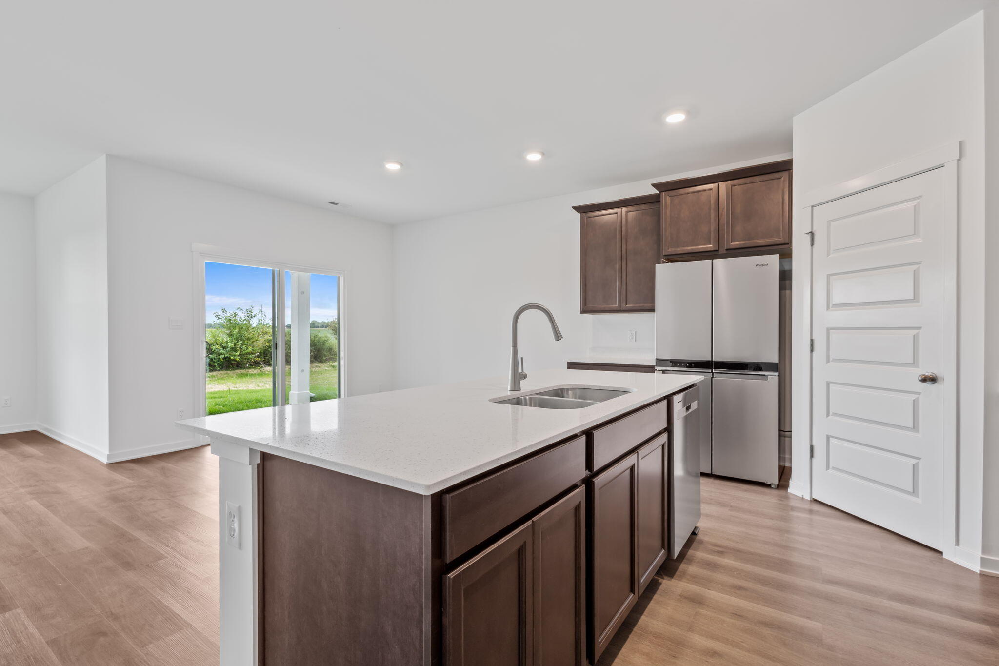 7293 West 107th Place Crown Point, IN 46307 - Photo 3 of 24 a kitchen with a sink appliances and cabinets