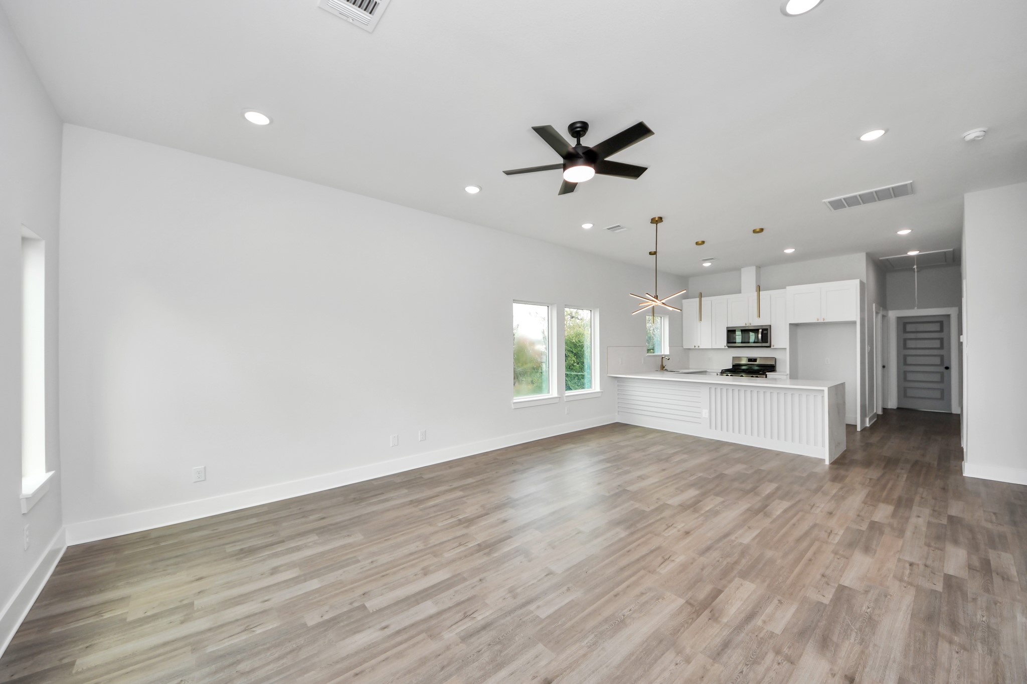 8114 Double Avenue, Unit B Houston, TX 77088 - Photo 13 of 34 a view of an empty room with kitchen appliances and a window