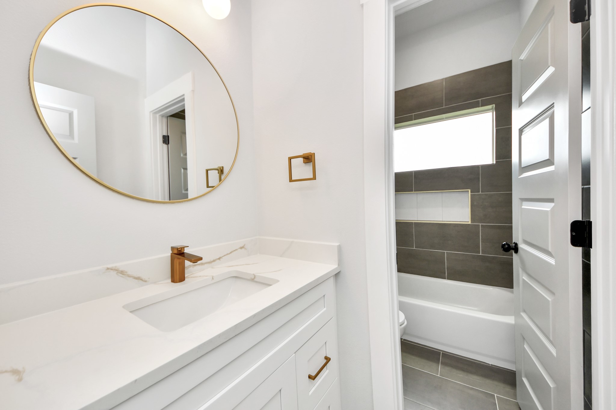 8114 Double Avenue, Unit B Houston, TX 77088 - Photo 17 of 34 a bathroom with a sink and a mirror