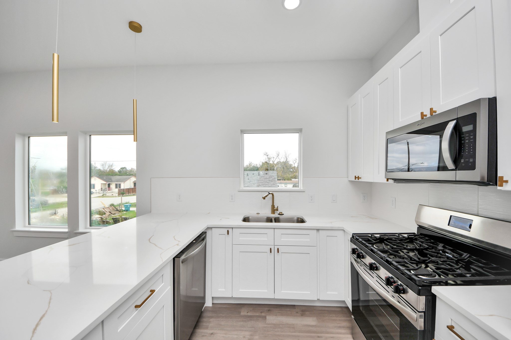 8114 Double Avenue, Unit B Houston, TX 77088 - Photo 2 of 34 a kitchen with a stove a sink and a window