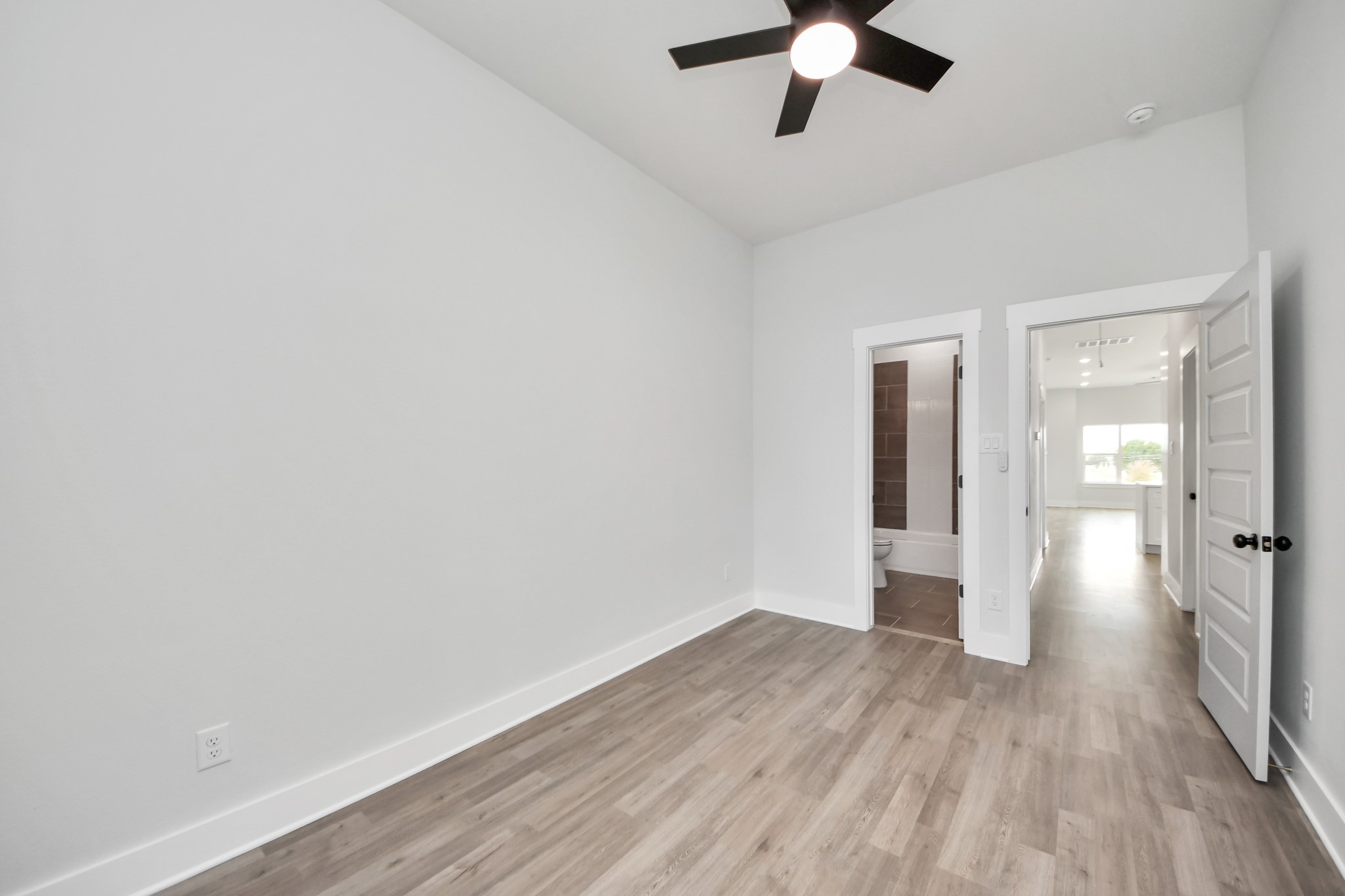 8114 Double Avenue, Unit B Houston, TX 77088 - Photo 23 of 34 wooden floor in an empty room with a window