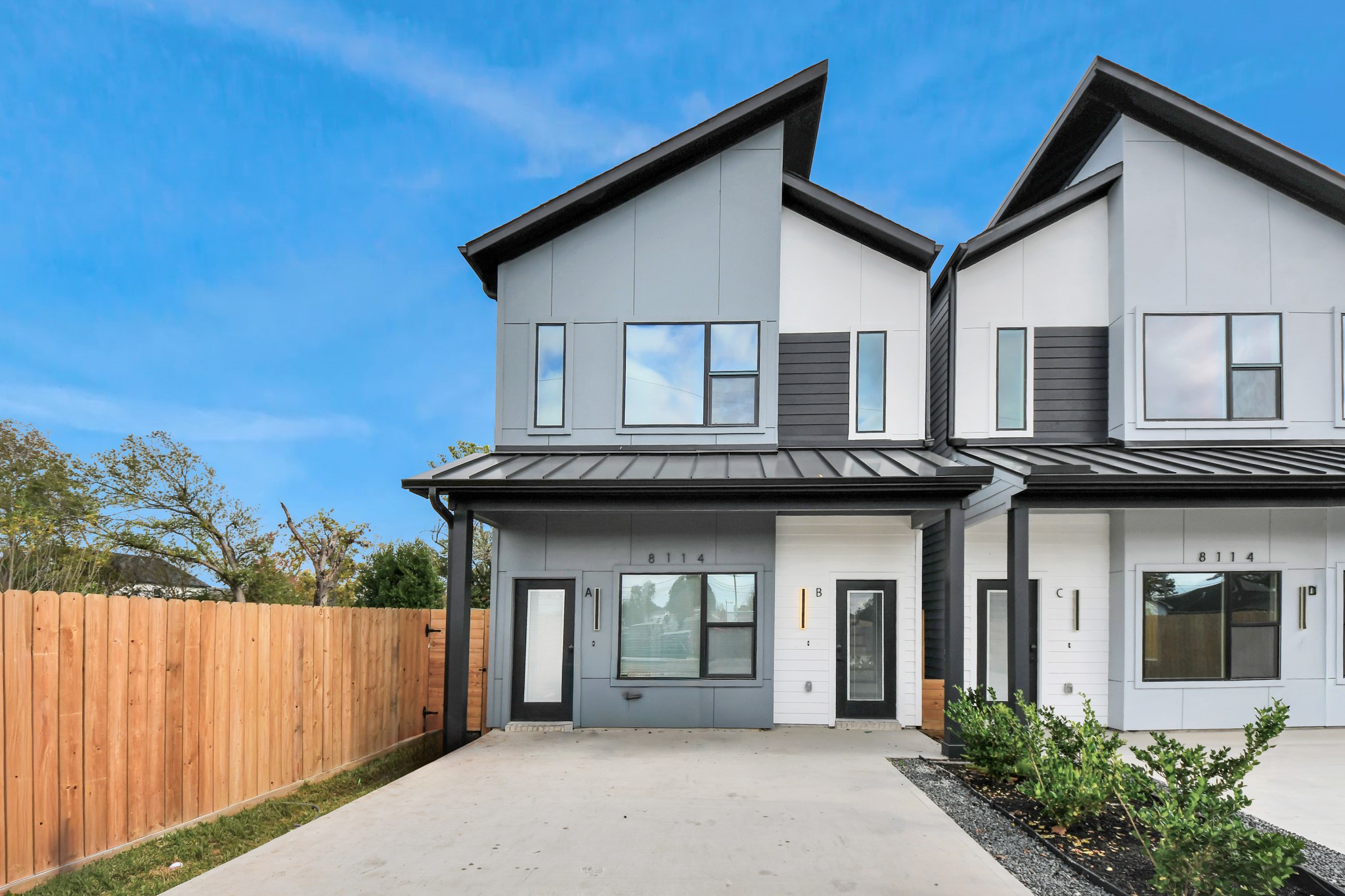 8114 Double Avenue, Unit B Houston, TX 77088 - Photo 30 of 34 a front view of a house with a garden