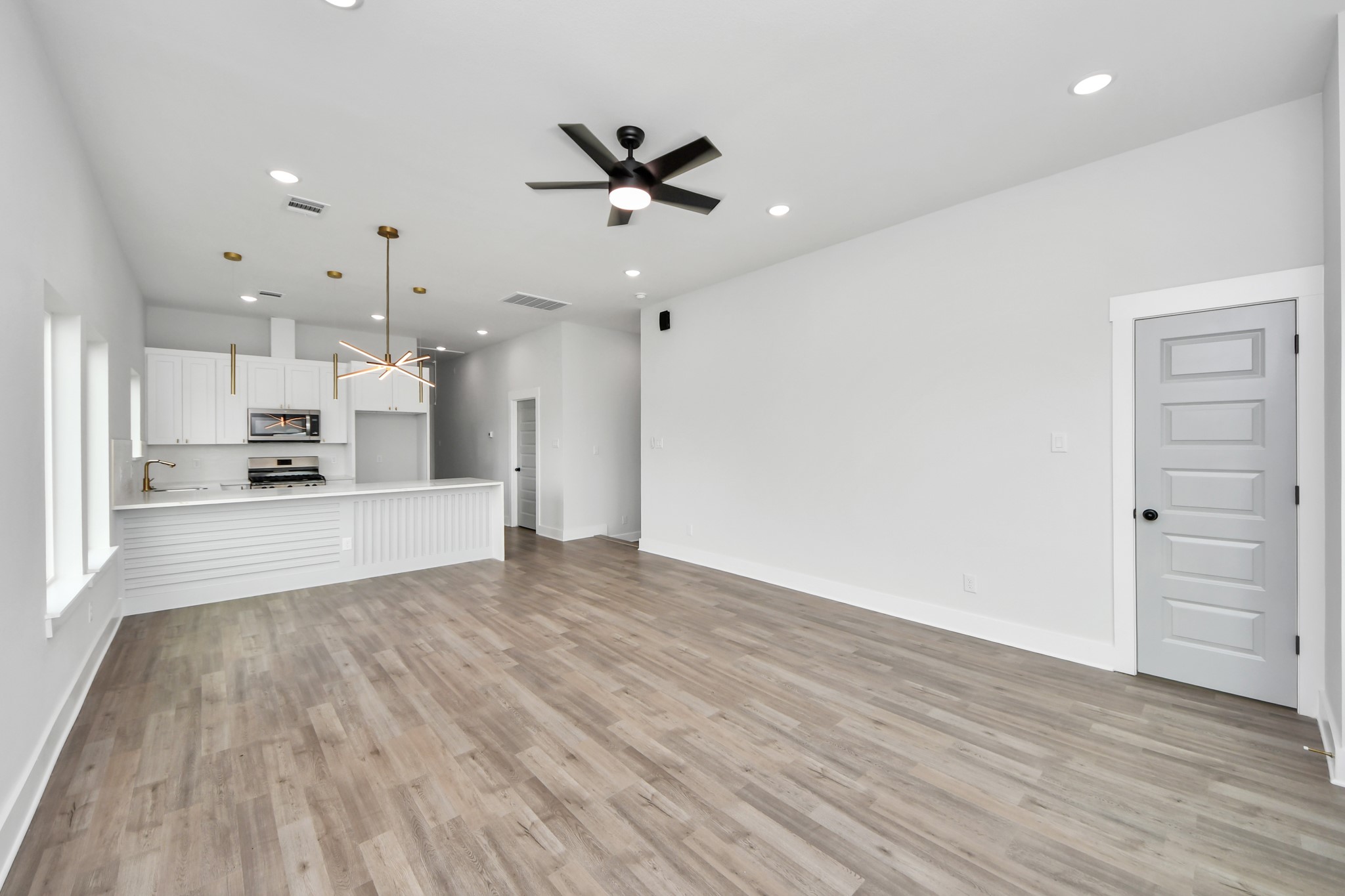 8114 Double Avenue, Unit B Houston, TX 77088 - Photo 5 of 34 a view of a kitchen with wooden floor and a kitchen