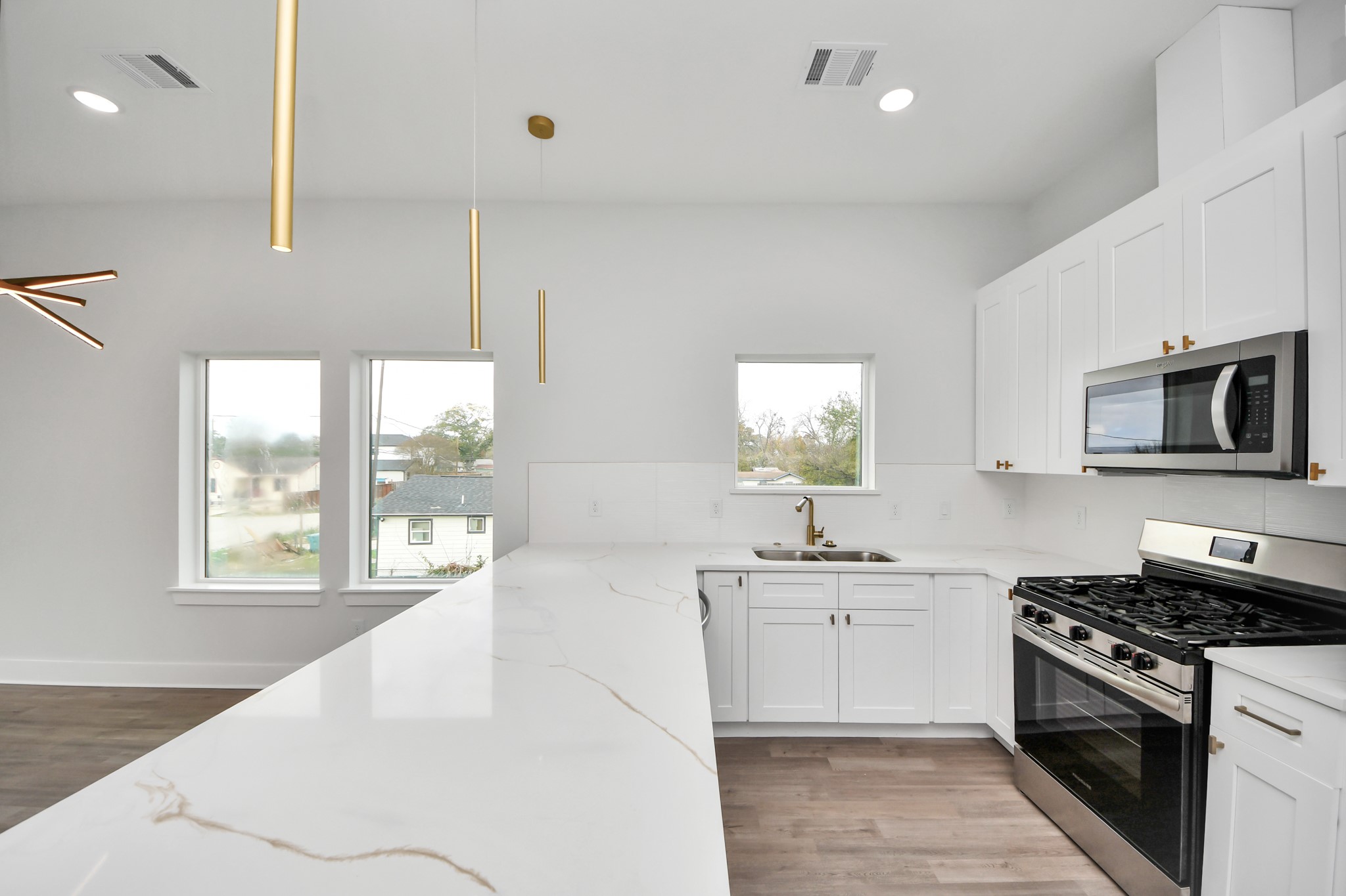 8114 Double Avenue, Unit B Houston, TX 77088 - Photo 7 of 34 a kitchen with stainless steel appliances a sink stove and cabinets
