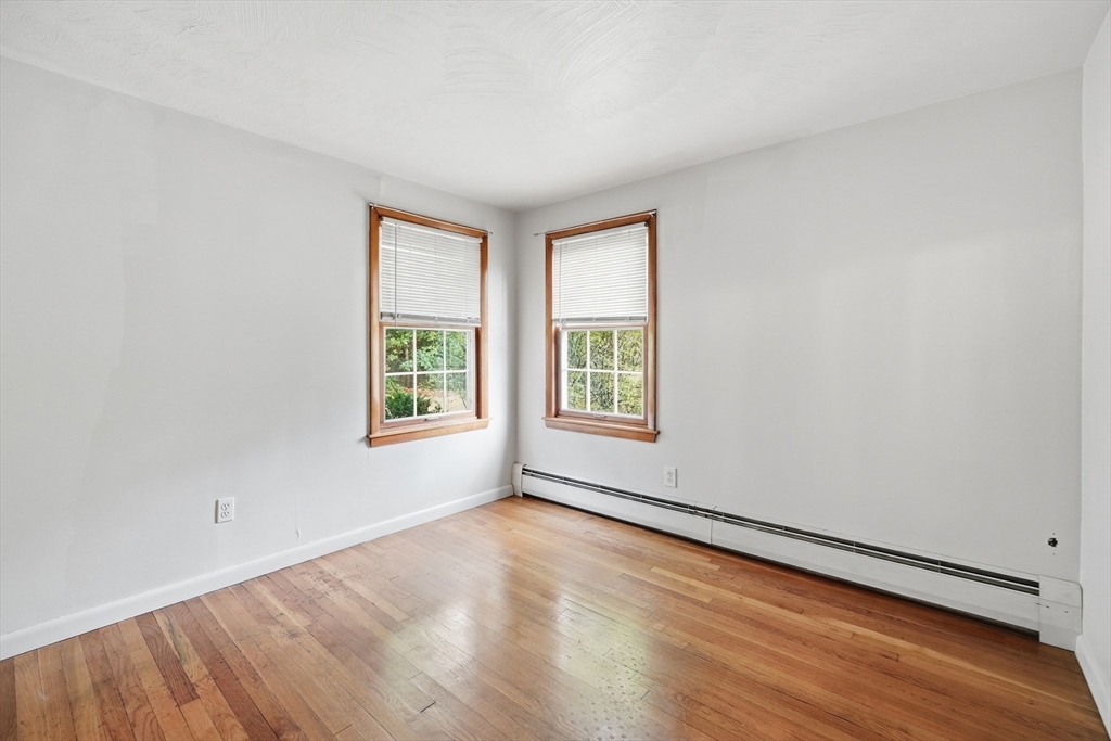 28 Spring Road Westborough, MA 01581 - Photo 17 of 42 an empty room with wooden floor and windows