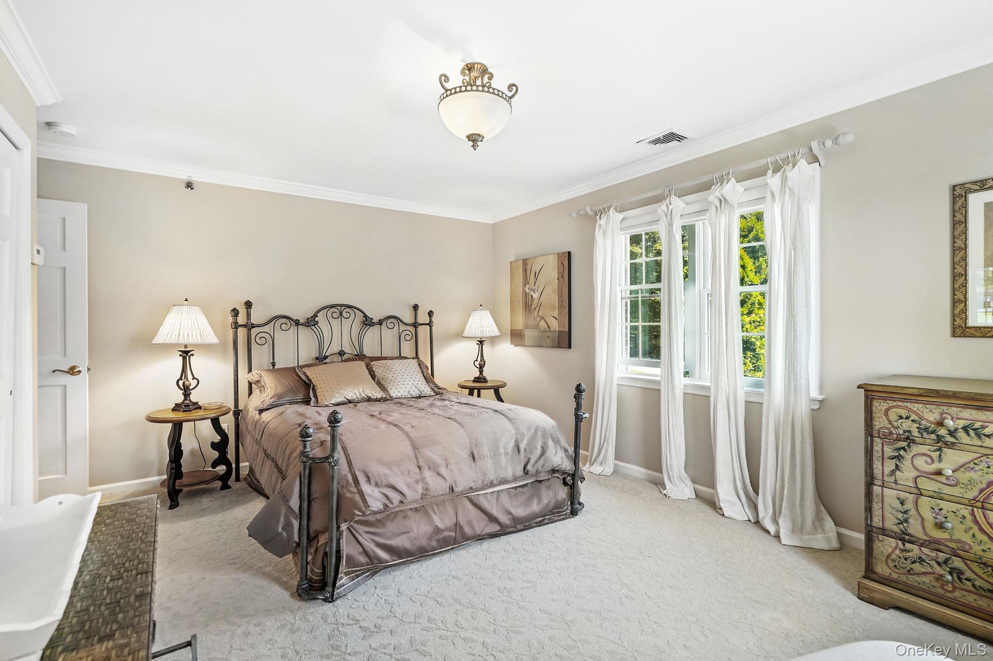 33 Hevelyne Road Elmsford, NY 10523 - Photo 19 of 43 Bedroom with ornamental molding and carpet floors