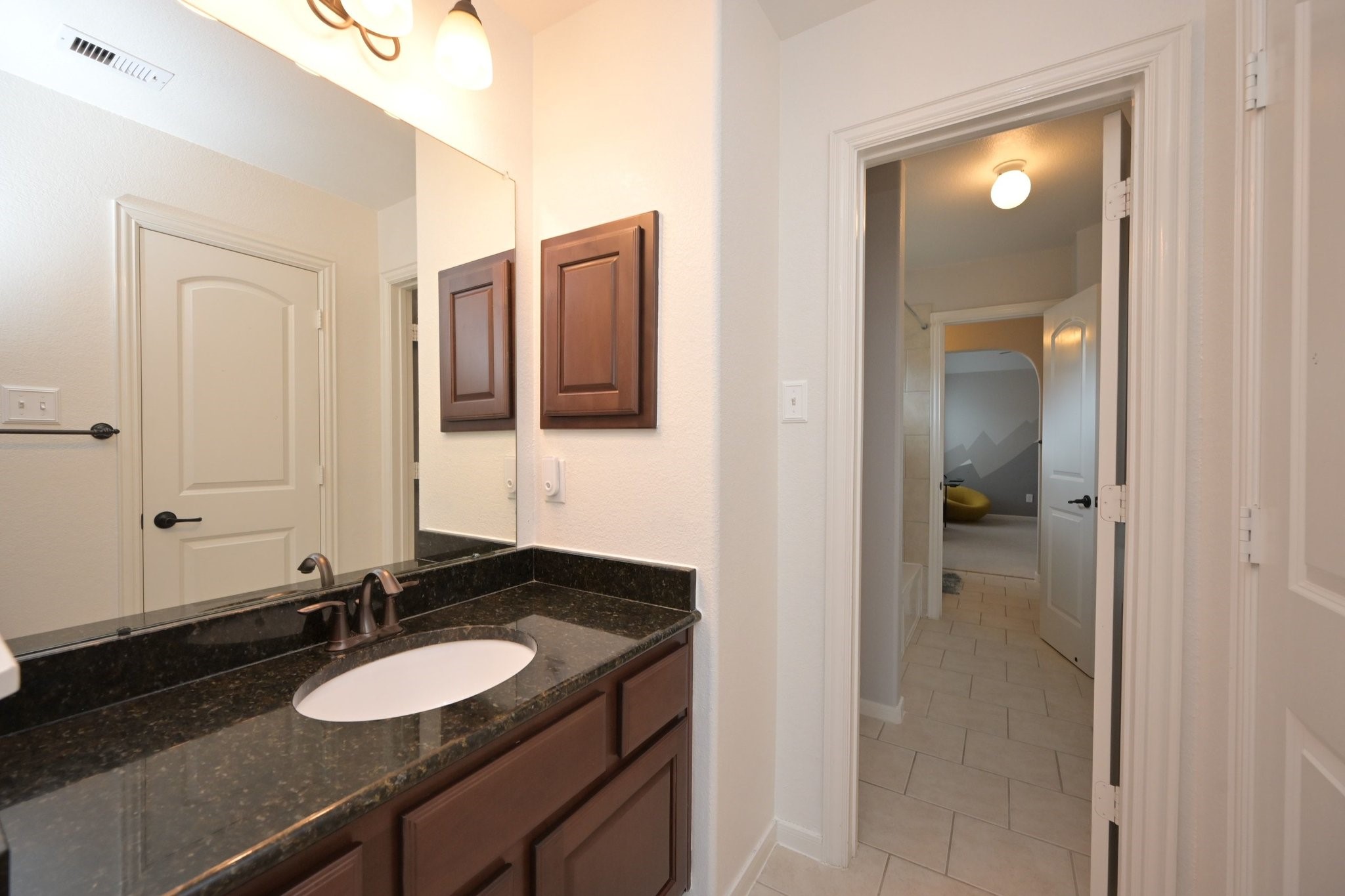 11 South Victoriana Circle Spring, TX 77389 - Photo 29 of 38 a bathroom with a sink and a mirror
