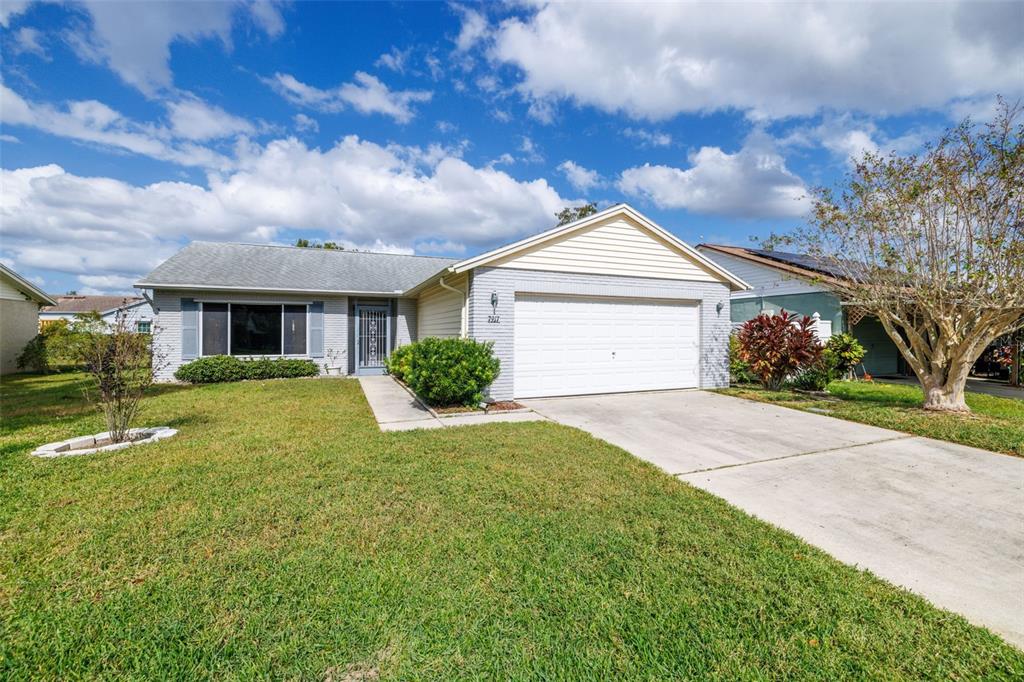 7917 Knox Loop New Port Richey, FL 34655 - Photo 1 of 1 a front view of a house with garden