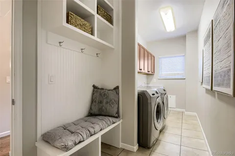 a hallway with a washer and dryer