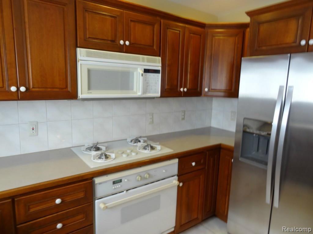 6202 West Road Washington, MI 48094 - Photo 6 of 29 Updated cherry cabinets