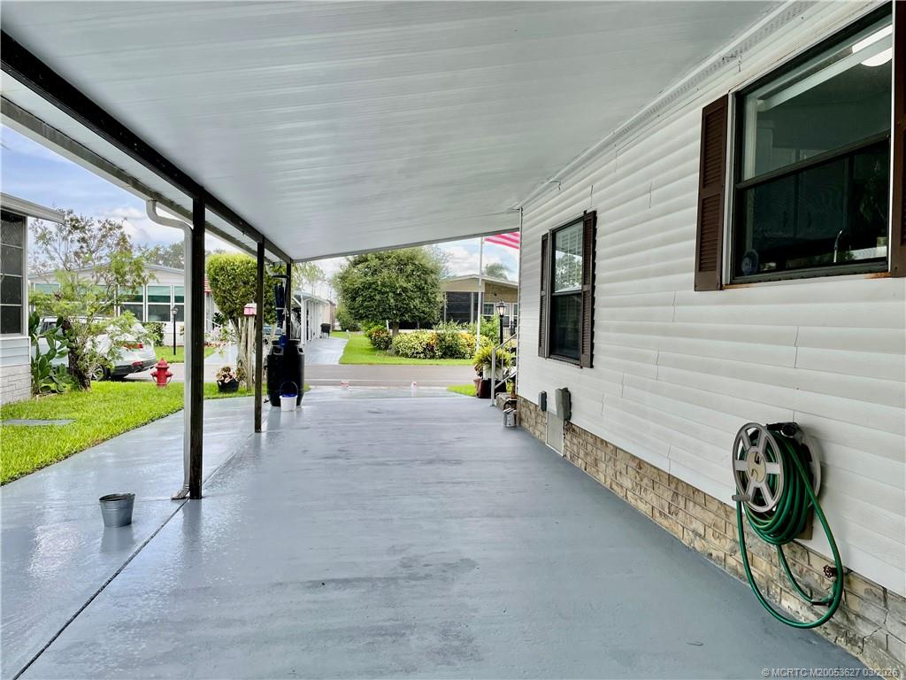 14524 Southwest Rake Drive Indiantown, FL 34956 - Photo 11 of 24 a view of a porch with seating space