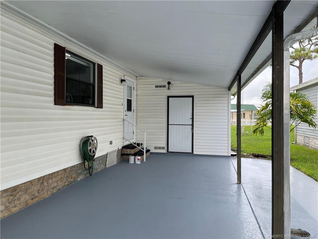 14524 Southwest Rake Drive Indiantown, FL 34956 - Photo 12 of 24 a view of a livingroom with chairs and a window