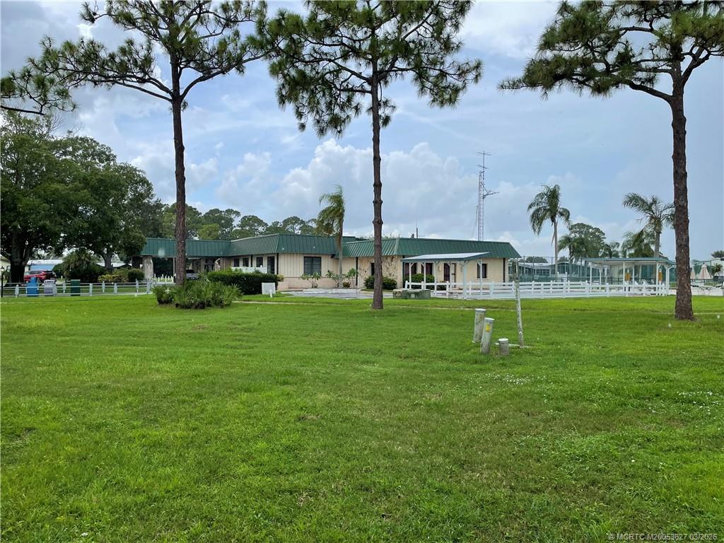 14524 Southwest Rake Drive Indiantown, FL 34956 - Photo 14 of 24 a view of an house with a garden