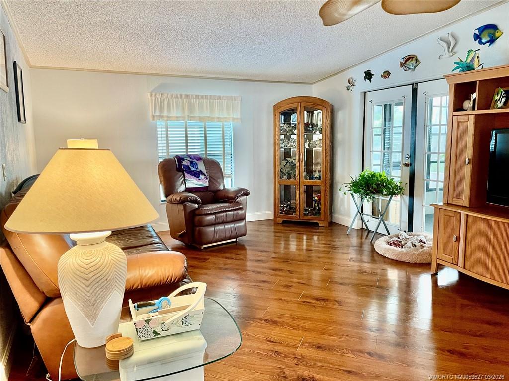 14524 Southwest Rake Drive Indiantown, FL 34956 - Photo 17 of 24 a living room with furniture and wooden floor