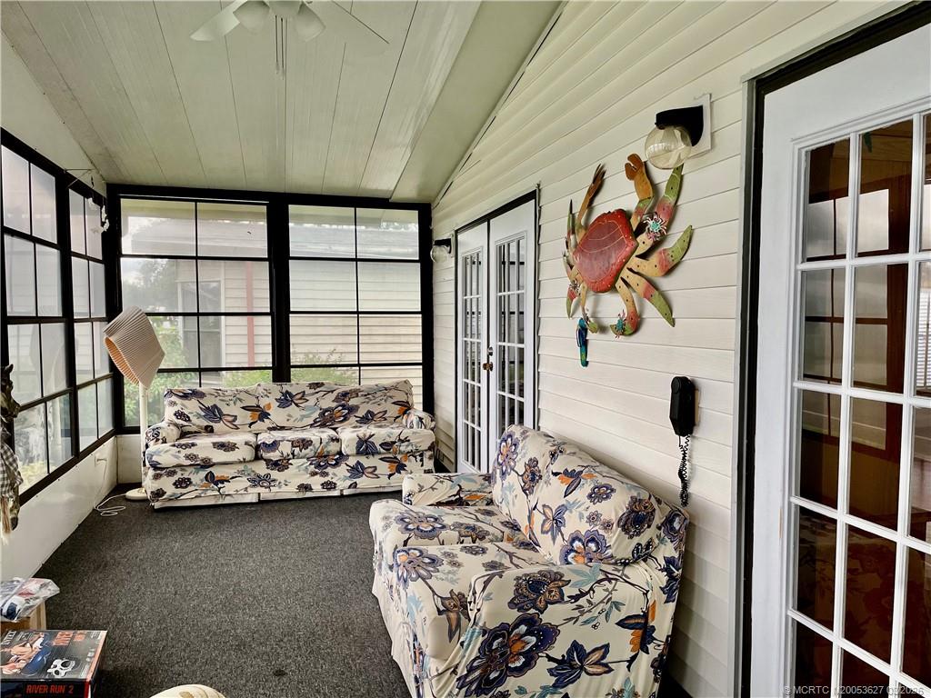 14524 Southwest Rake Drive Indiantown, FL 34956 - Photo 3 of 24 a bedroom with furniture and a window