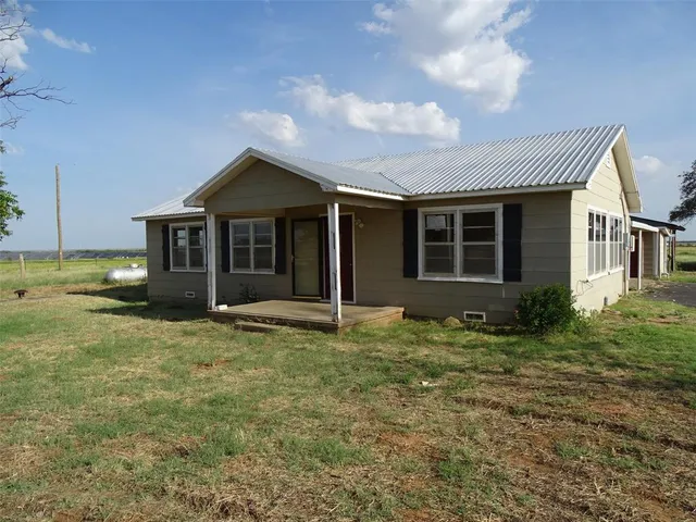 a house with yard in front of it