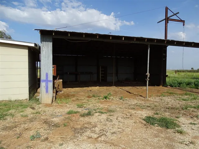 a wooden door with a yard