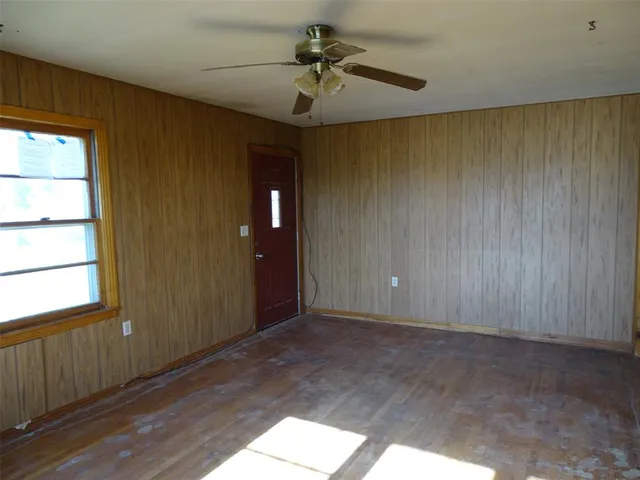 a view of an empty room and a window