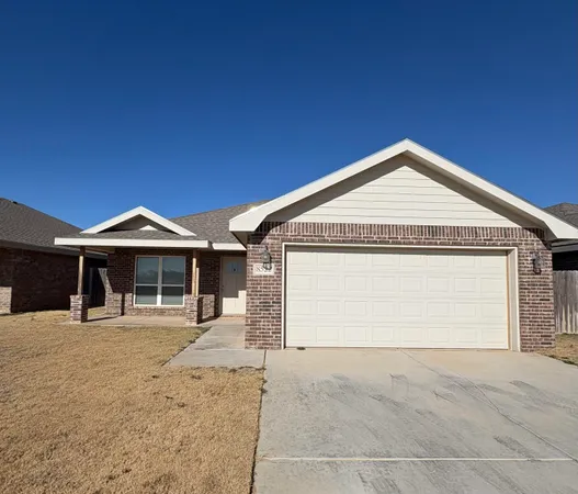 a front view of a house with a garage