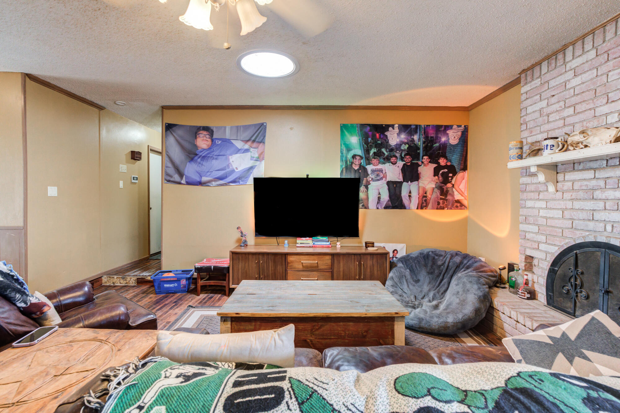 4802 53rd Street Lubbock, TX 79414 - Photo 17 of 31 a living room with furniture and a flat screen tv