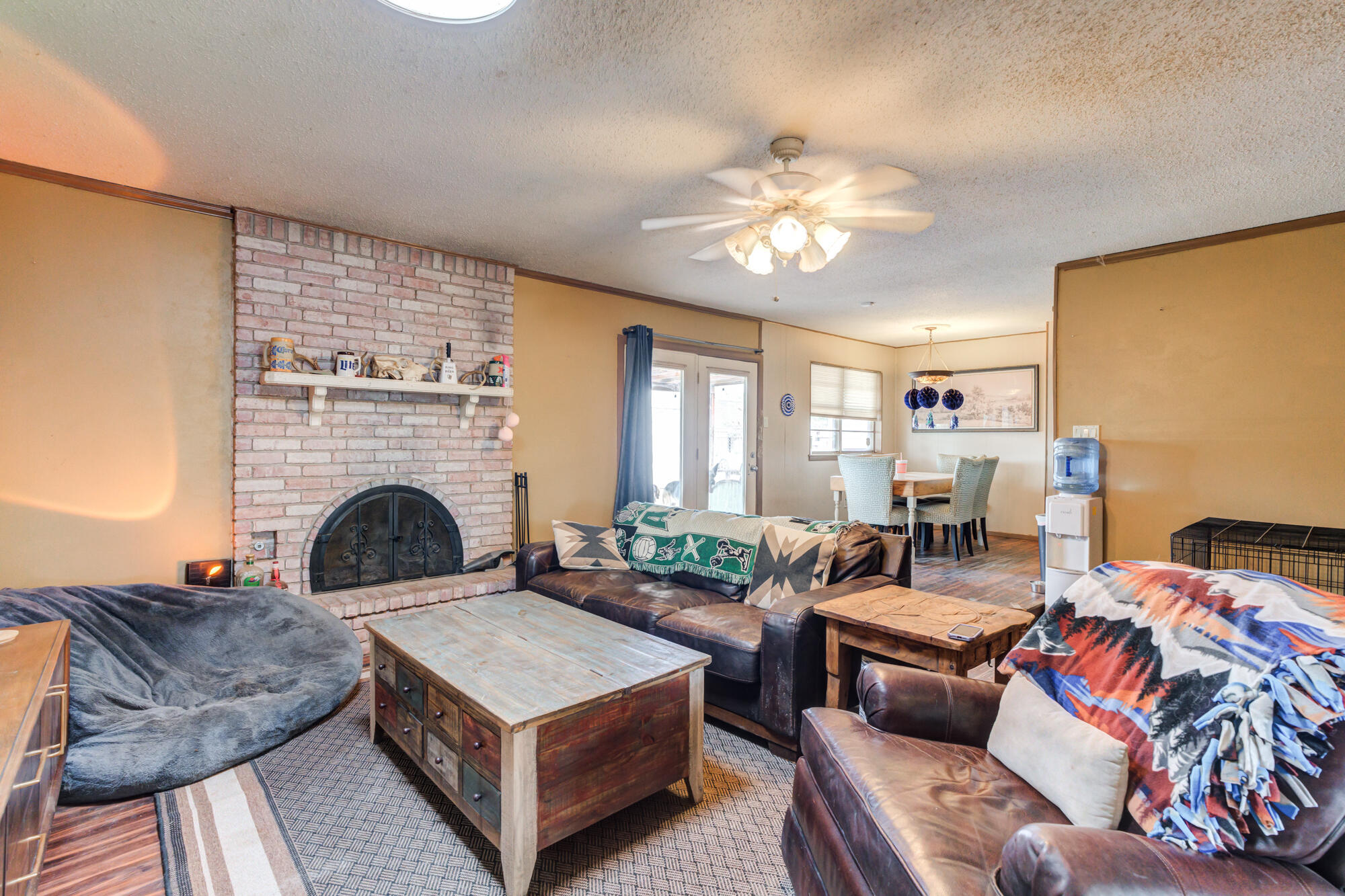 4802 53rd Street Lubbock, TX 79414 - Photo 19 of 31 a living room with furniture and a fireplace