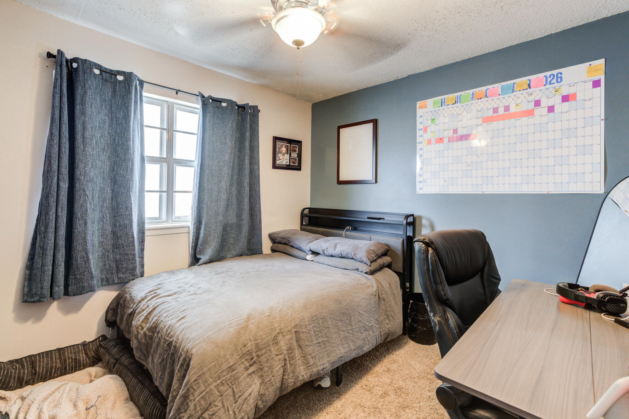 4802 53rd Street Lubbock, TX 79414 - Photo 20 of 31 a bedroom with a bed and window