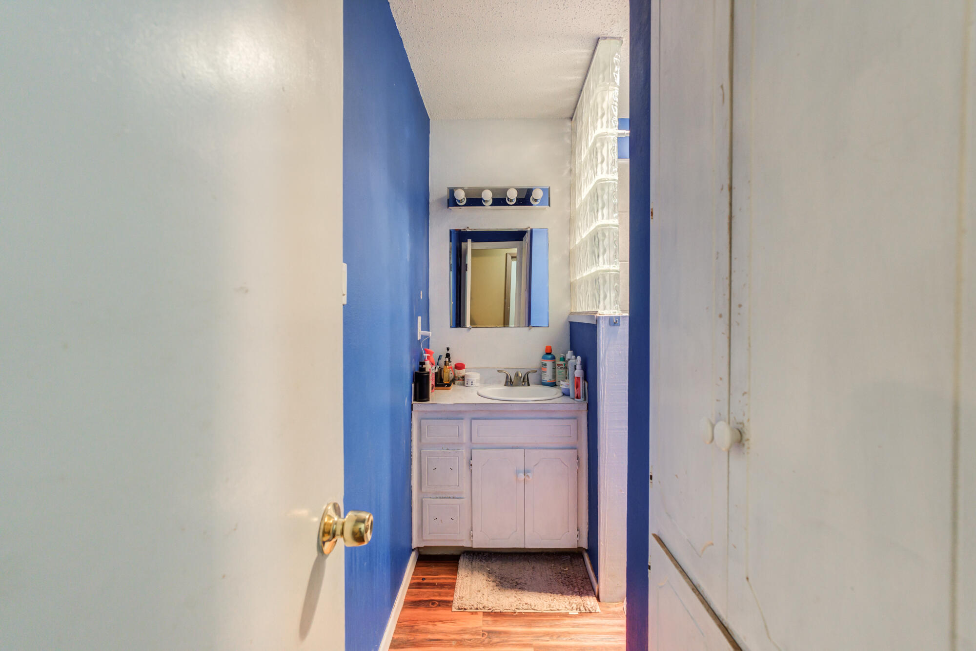 4802 53rd Street Lubbock, TX 79414 - Photo 25 of 31 a view of a hallway and a room with mirror