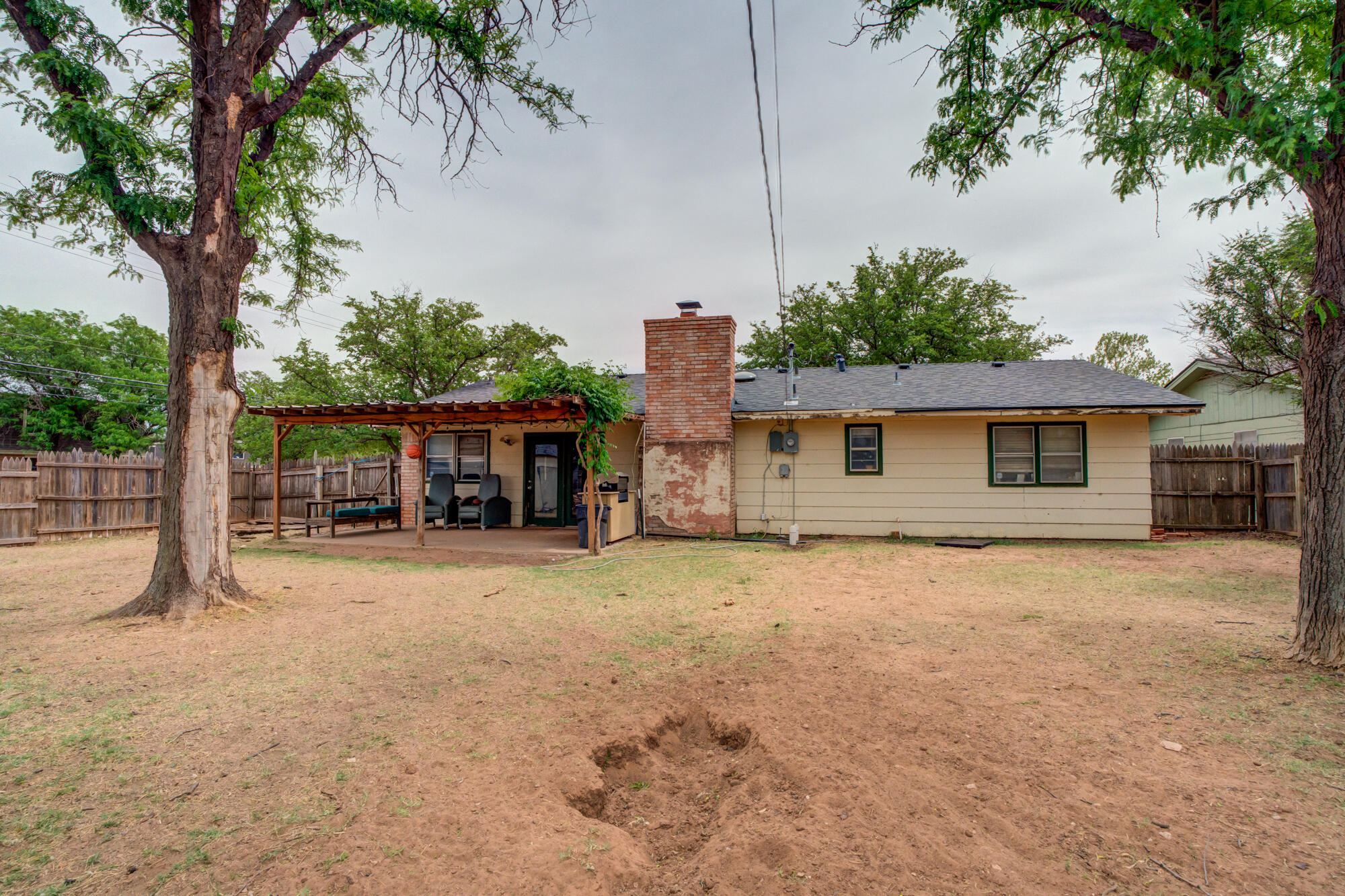 4802 53rd Street Lubbock, TX 79414 - Photo 30 of 31 a front view of a house with a yard and garage