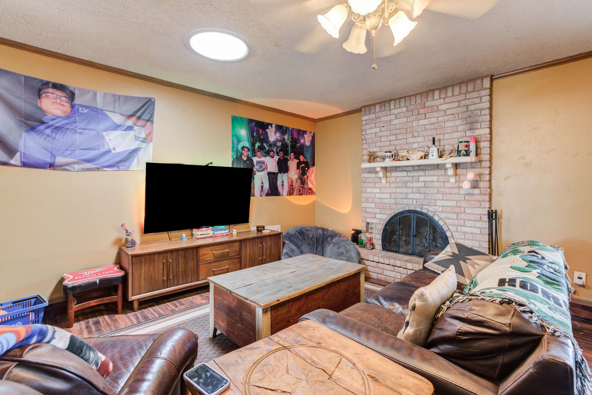 4802 53rd Street Lubbock, TX 79414 - Photo 3 of 31 a living room with furniture and a flat screen tv
