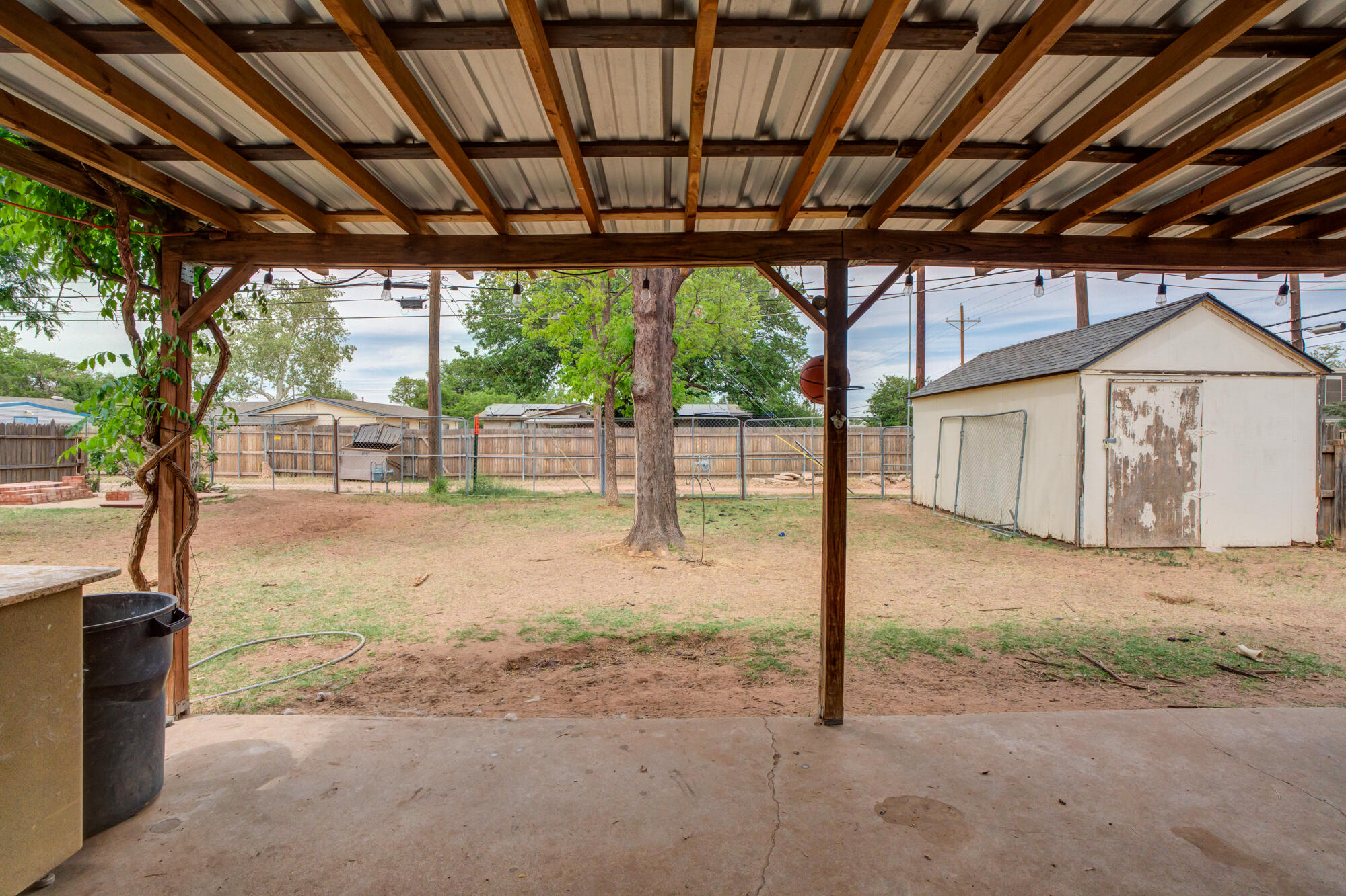 4802 53rd Street Lubbock, TX 79414 - Photo 5 of 31 a house with trees in the background