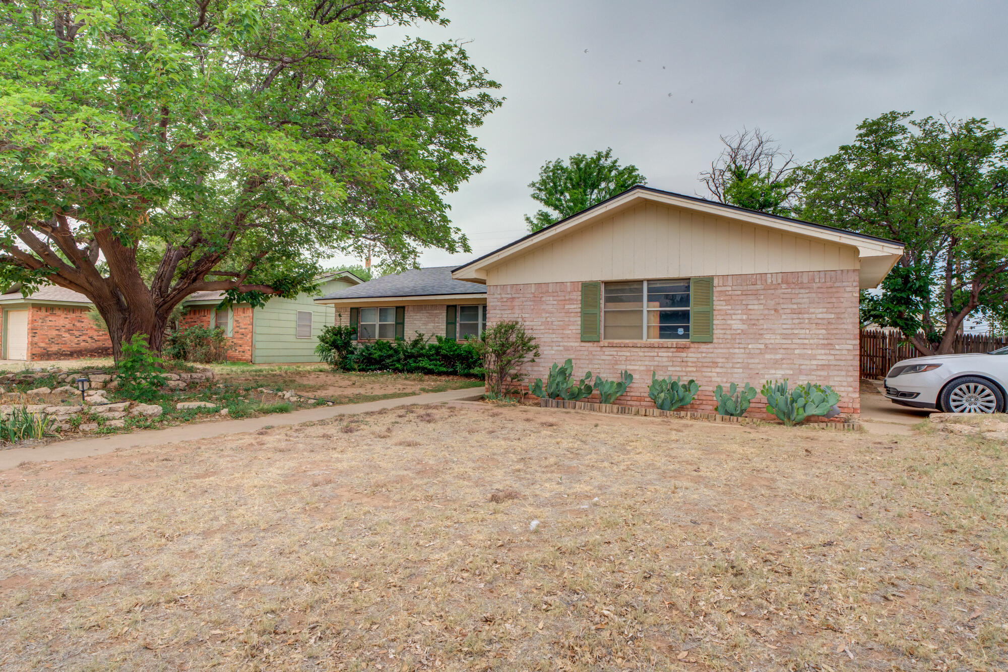 4802 53rd Street Lubbock, TX 79414 - Photo 6 of 31 front view of a house with a yard