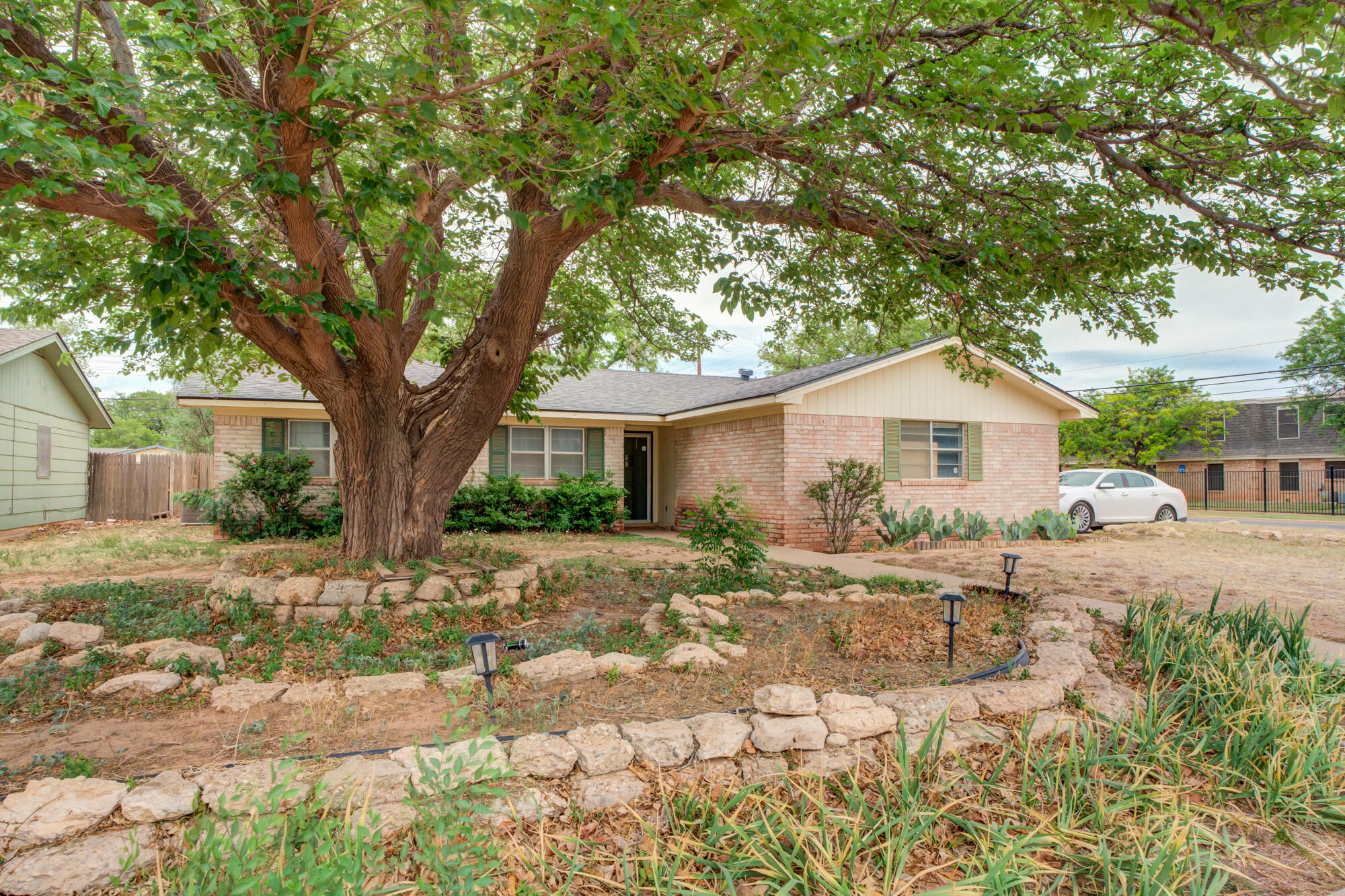 4802 53rd Street Lubbock, TX 79414 - Photo 7 of 31 a front view of a house with a yard