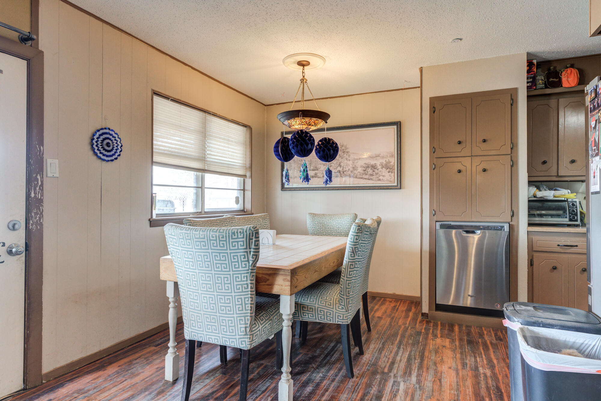 4802 53rd Street Lubbock, TX 79414 - Photo 9 of 31 a view of a dining room with furniture window and wooden floor