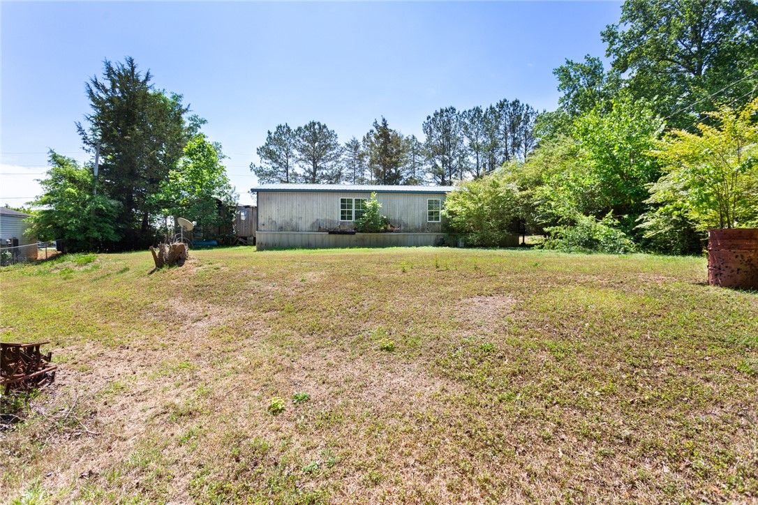 209 Short Cut Road Westminster, SC 29693 - Photo 4 of 27 Expansive outdoor space with mature trees provides ample room for outdoor activities.
