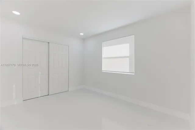 a view of hallway with closet