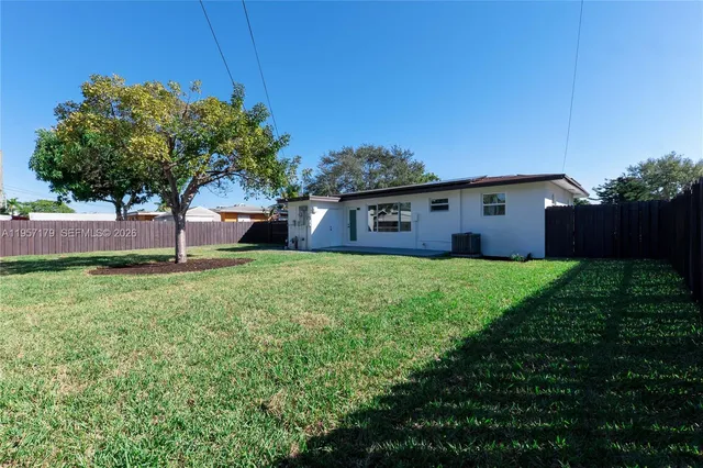 a house view with a garden space