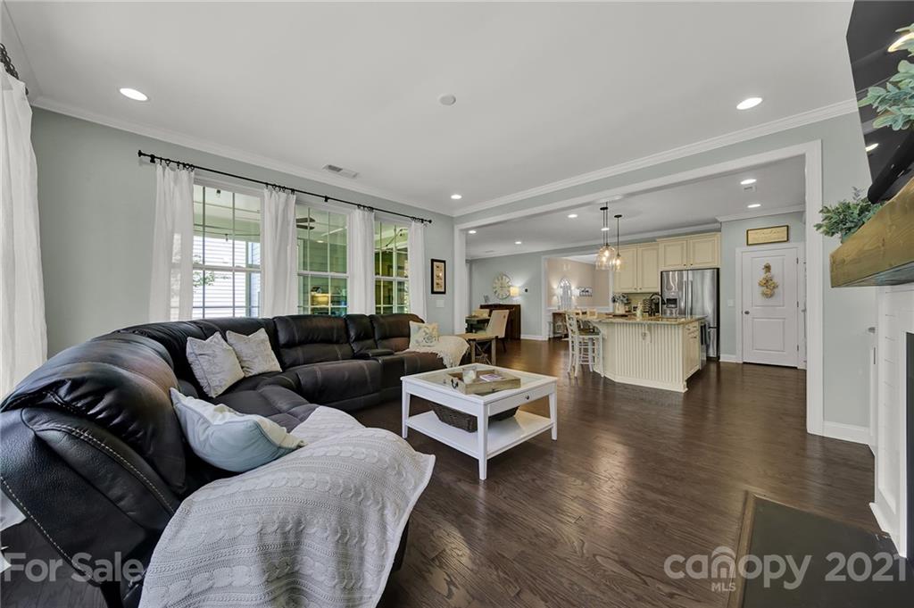 1033 Emory Lane Fort Mill, SC 29708 - Photo 17 of 48 a living room with furniture or kitchen view and a wooden floor