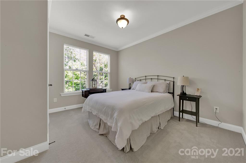 1033 Emory Lane Fort Mill, SC 29708 - Photo 21 of 48 a spacious bedroom with a bed and a window